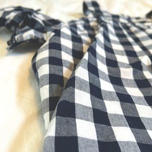 Dressy checkered shoulder cut top with button in the back